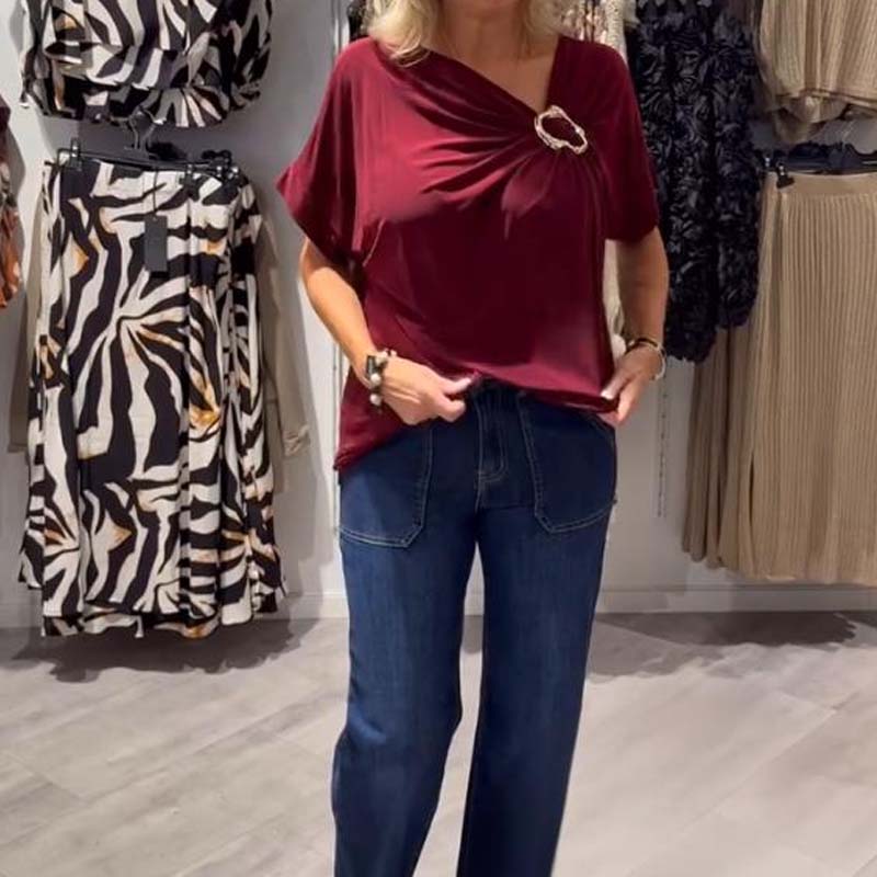 Stilingas moteriškas asimetriškos iškirptės viršus trumpomis rankovėmis