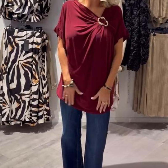 Stilingas moteriškas asimetriškos iškirptės viršus trumpomis rankovėmis