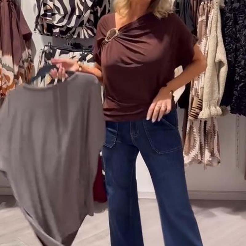 Stilingas moteriškas asimetriškos iškirptės viršus trumpomis rankovėmis