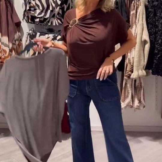 Stilingas moteriškas asimetriškos iškirptės viršus trumpomis rankovėmis