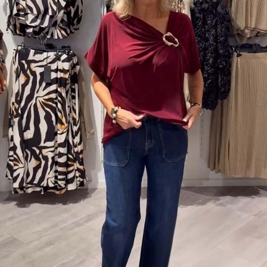 Stilingas moteriškas asimetriškos iškirptės viršus trumpomis rankovėmis